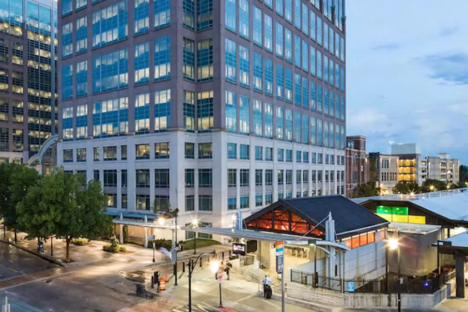 Rendering of TOD with two glass towers abovw MARTA transit station in Kensington near Atlanta, Georgia.